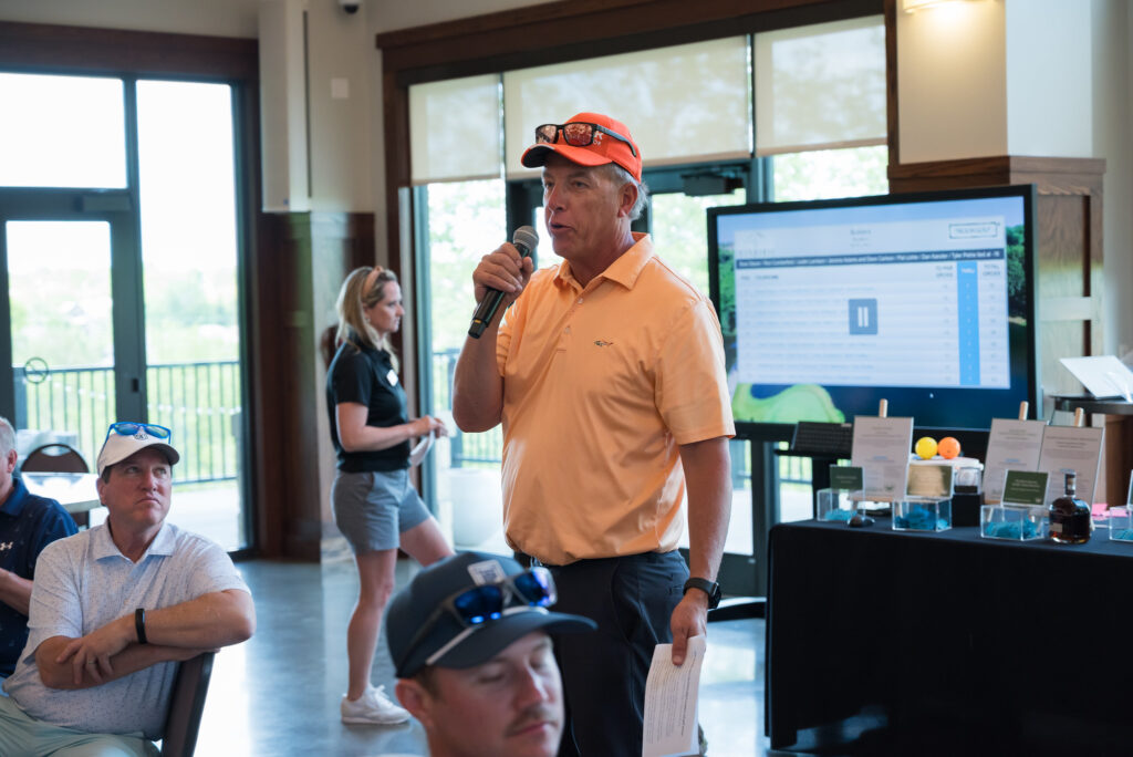 Phil Thomas talking at Builders Construction Scholarship golf fundraiser